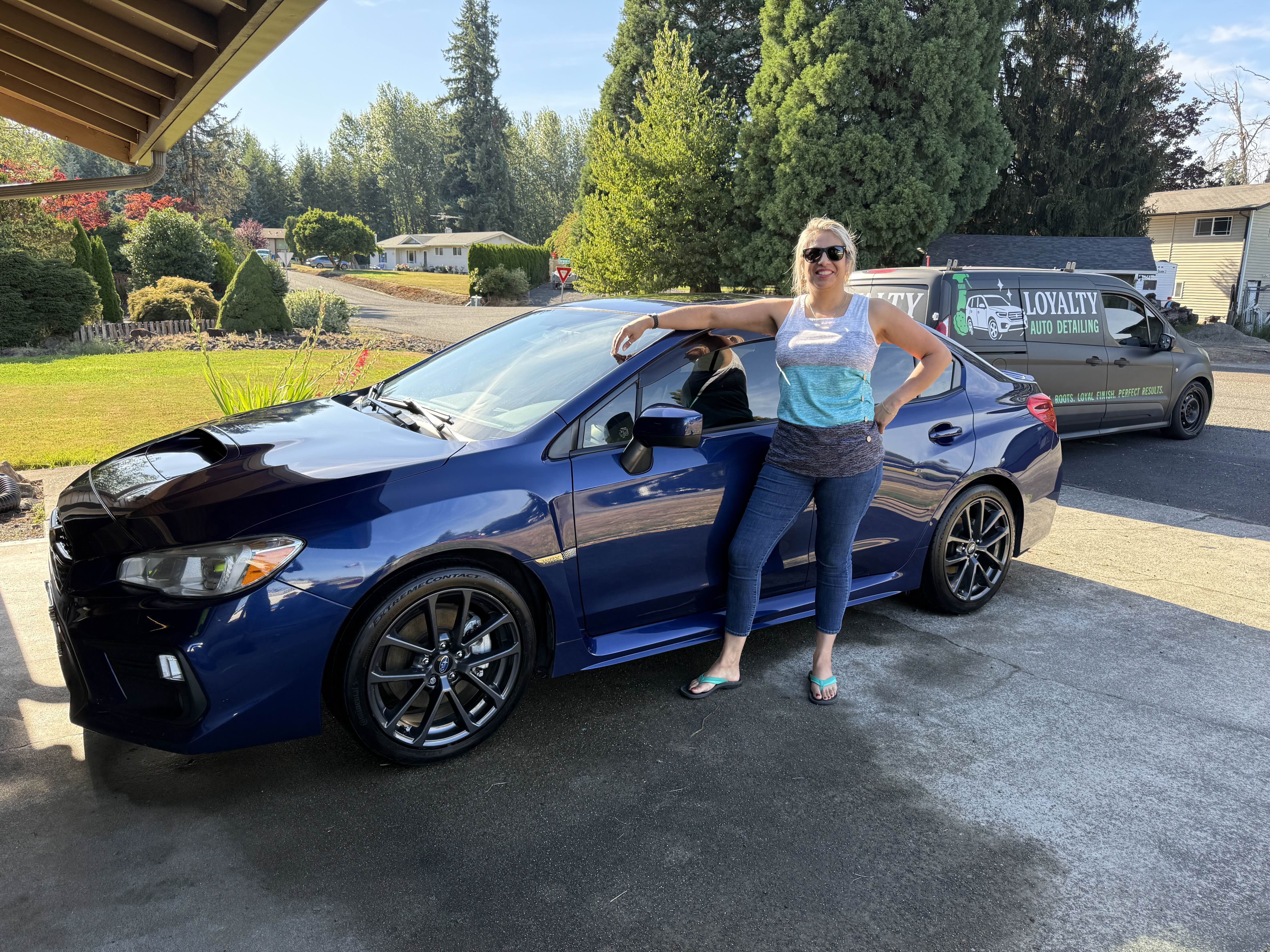 Happy customer with detailed blue Subaru WRX
